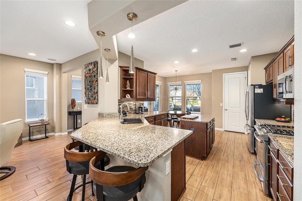 5589 Northwest 40th Loop Ocala, FL 34482 - Photo 15 of 47 a living room with furniture and a flat screen tv