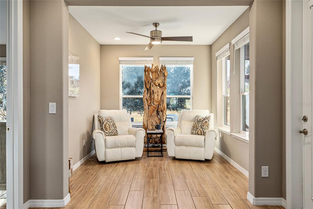 5589 Northwest 40th Loop Ocala, FL 34482 - Photo 21 of 47 a living room with furniture and a large window