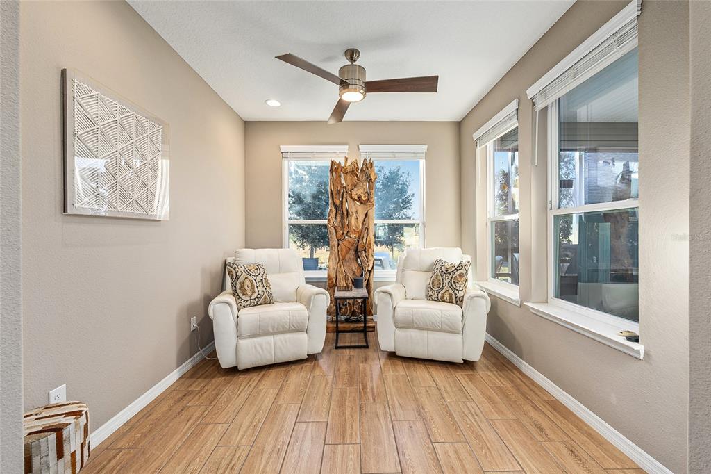 5589 Northwest 40th Loop Ocala, FL 34482 - Photo 22 of 47 a living room with furniture and a large window