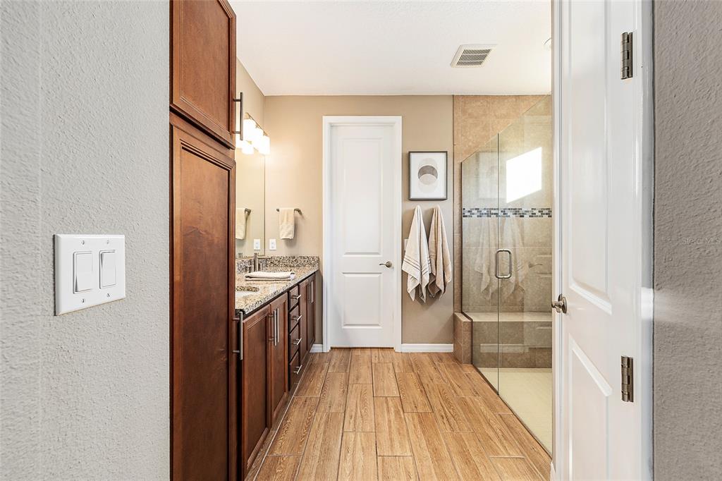 5589 Northwest 40th Loop Ocala, FL 34482 - Photo 27 of 47 a bathroom with a sink and a mirror