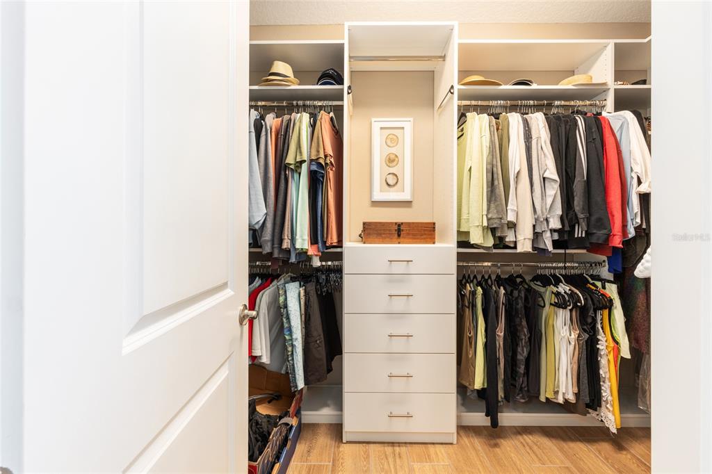 5589 Northwest 40th Loop Ocala, FL 34482 - Photo 30 of 47 a view of walk in closet with clothes