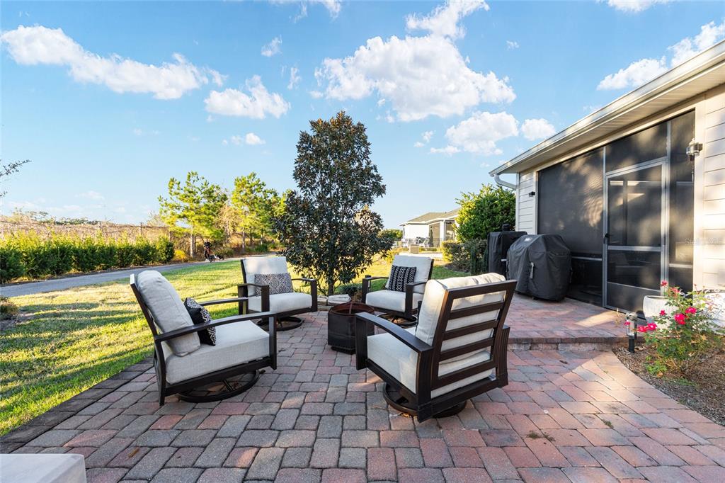 5589 Northwest 40th Loop Ocala, FL 34482 - Photo 38 of 47 a outdoor living space with furniture and garden view
