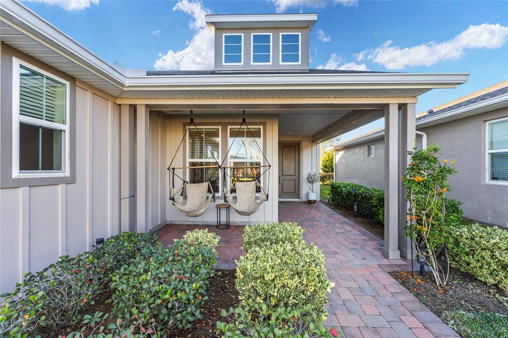 5589 Northwest 40th Loop Ocala, FL 34482 - Photo 4 of 47 a front view of a house with garden