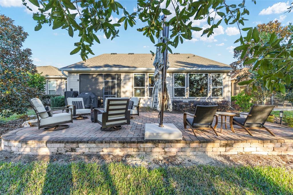 5589 Northwest 40th Loop Ocala, FL 34482 - Photo 42 of 47 a view of a house with backyard porch and sitting area