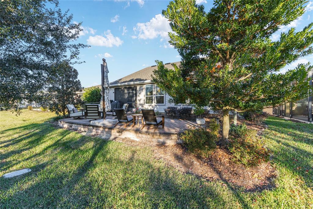 5589 Northwest 40th Loop Ocala, FL 34482 - Photo 43 of 47 a view of swimming pool with sitting area and garden