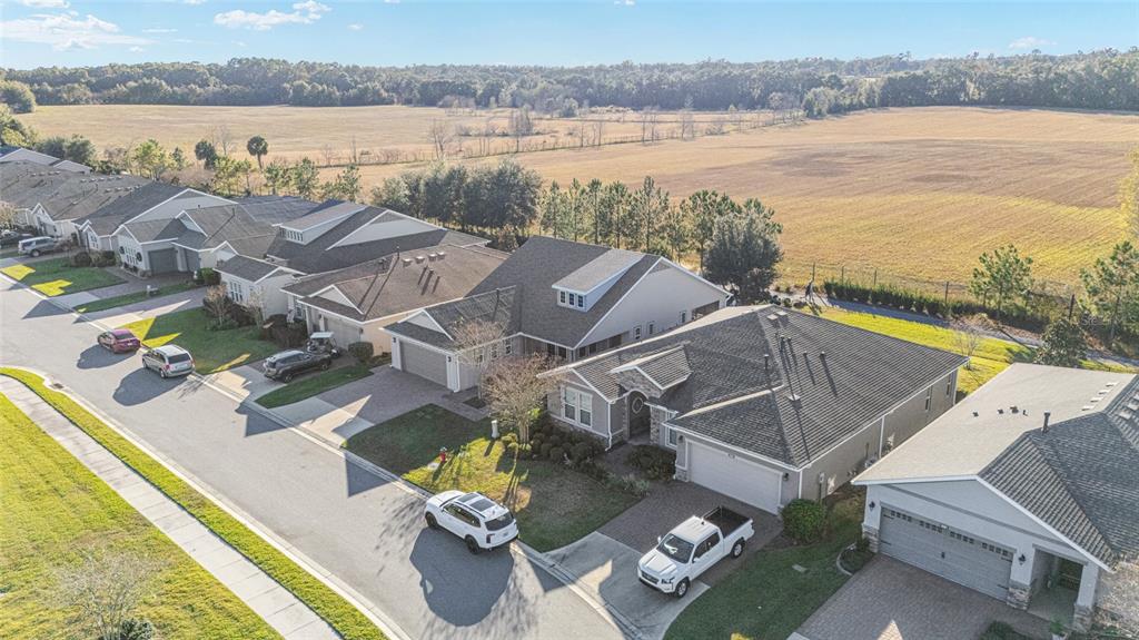 5589 Northwest 40th Loop Ocala, FL 34482 - Photo 47 of 47 a view of a house with pool and ocean view