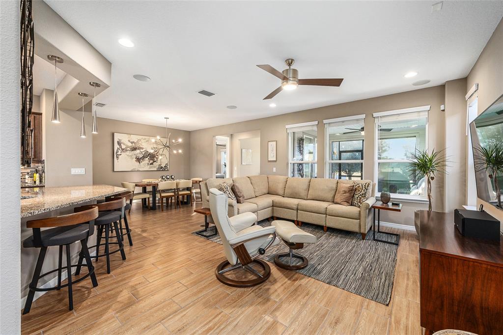 5589 Northwest 40th Loop Ocala, FL 34482 - Photo 9 of 47 a living room with furniture and wooden floor