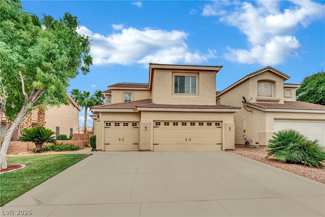 1724 Millstream Way Henderson, NV 89074 - Photo 1 of 60 A well-maintained facade features an attached garage and desert-friendly landscaping.