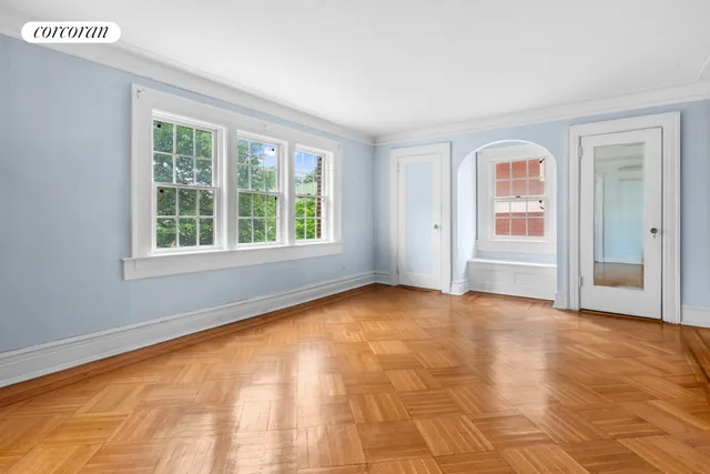 a kitchen with stainless steel appliances granite countertop a sink and cabinets with wooden floor