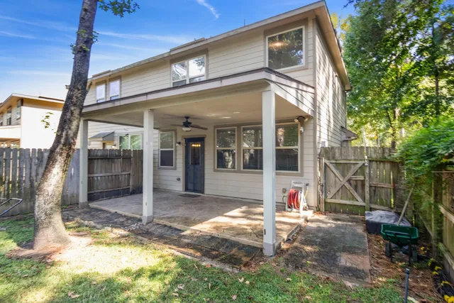 a view of a house with backyard porch and sitting area