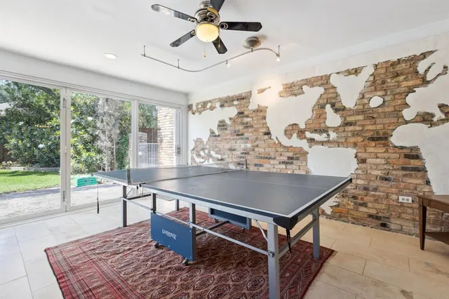 a view of a dining room with furniture and a chandelier