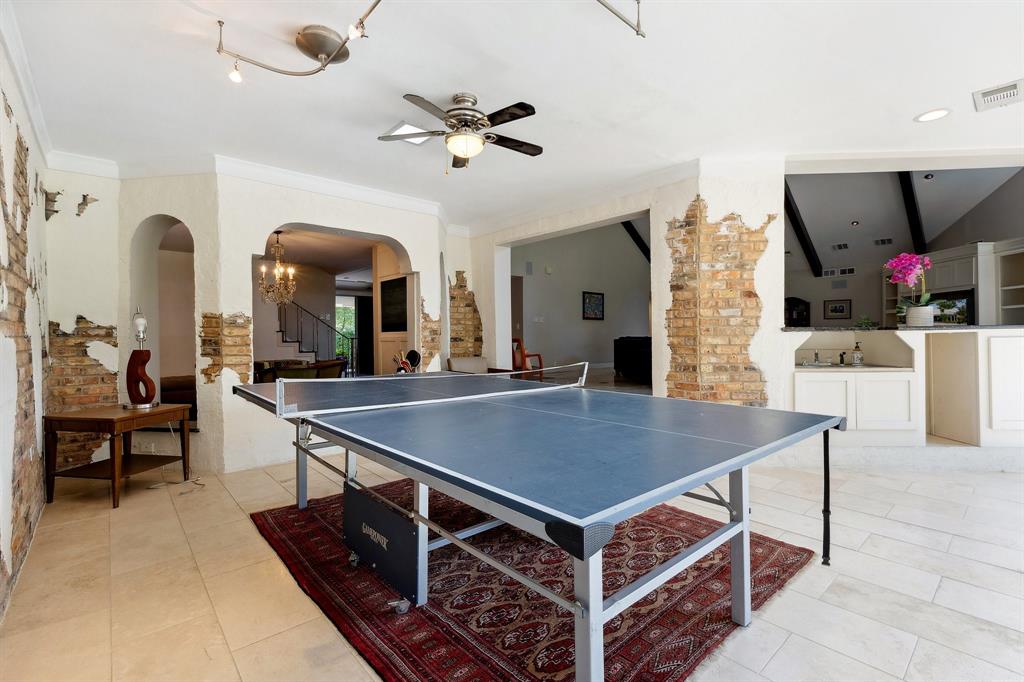 6160 Spring Valley Road Dallas, TX 75240 - Photo 20 of 40 a view of a dining room with furniture and a chandelier