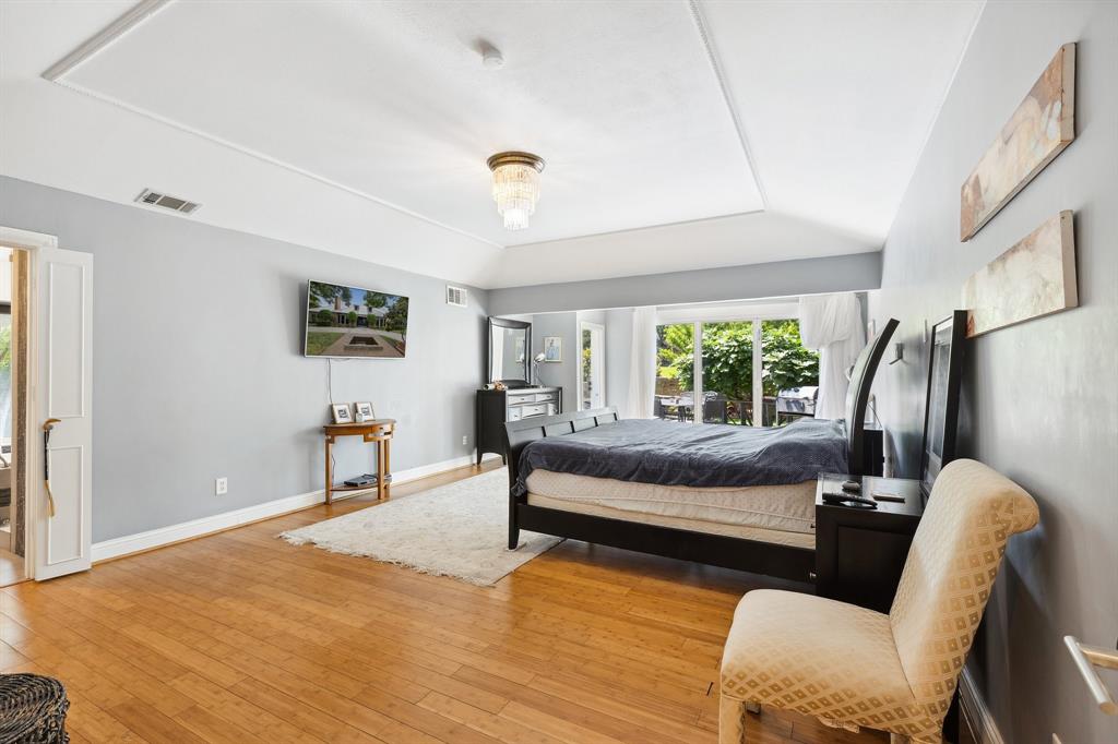 6160 Spring Valley Road Dallas, TX 75240 - Photo 25 of 40 a bedroom with furniture and a large window
