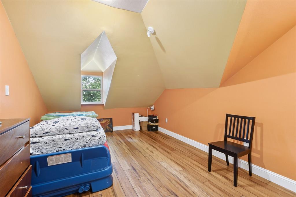 6160 Spring Valley Road Dallas, TX 75240 - Photo 33 of 40 a bedroom with a bed and a window