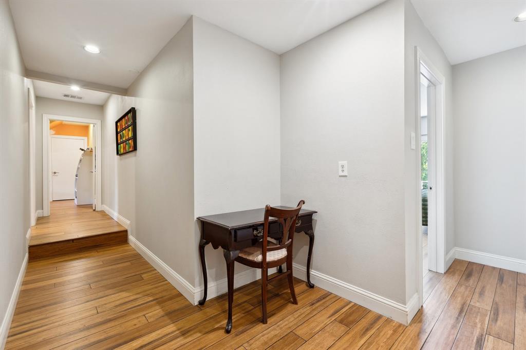 6160 Spring Valley Road Dallas, TX 75240 - Photo 34 of 40 a view of a hallway with wooden floor and furniture