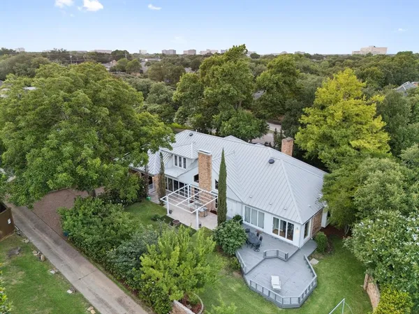 an aerial view of a house with a garden