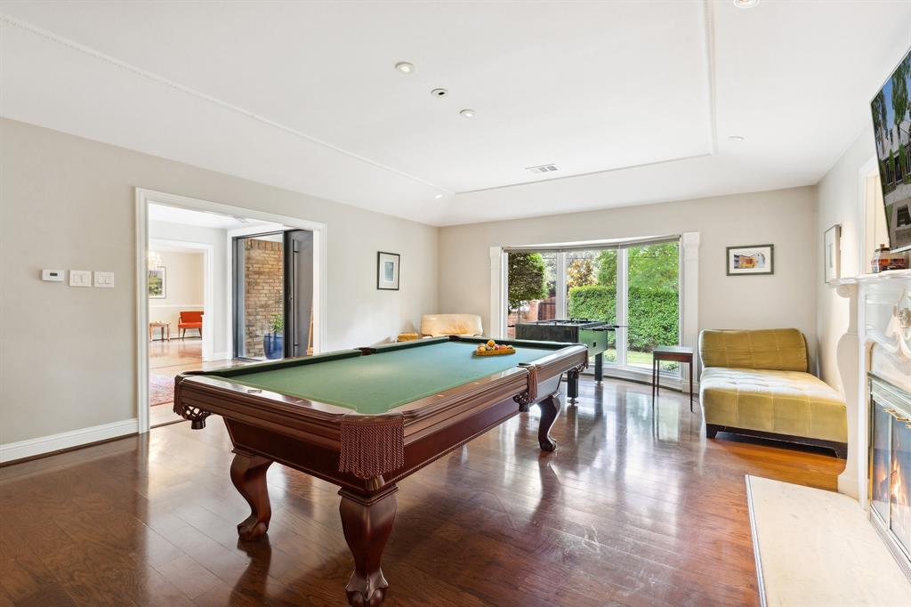 6160 Spring Valley Road Dallas, TX 75240 - Photo 6 of 40 a room with furniture pool table wooden floor and windows