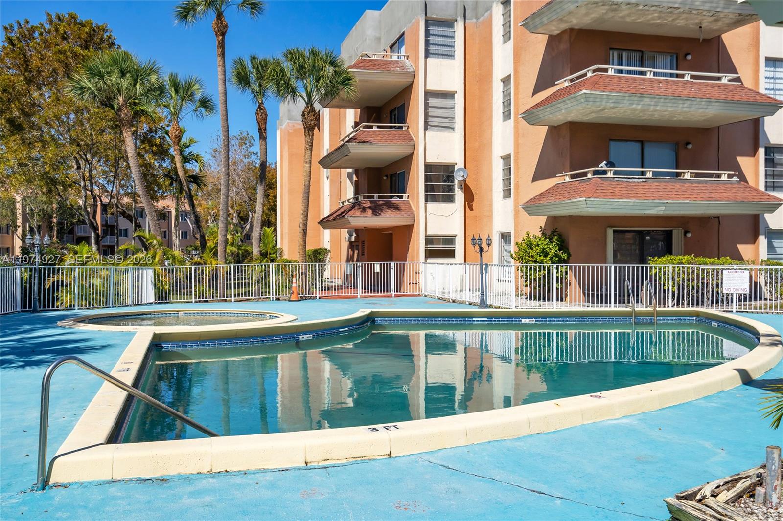 17530 Northwest 68th Avenue, Unit C2003 Hialeah, FL 33015 - Photo 6 of 20 a view of a building from a balcony