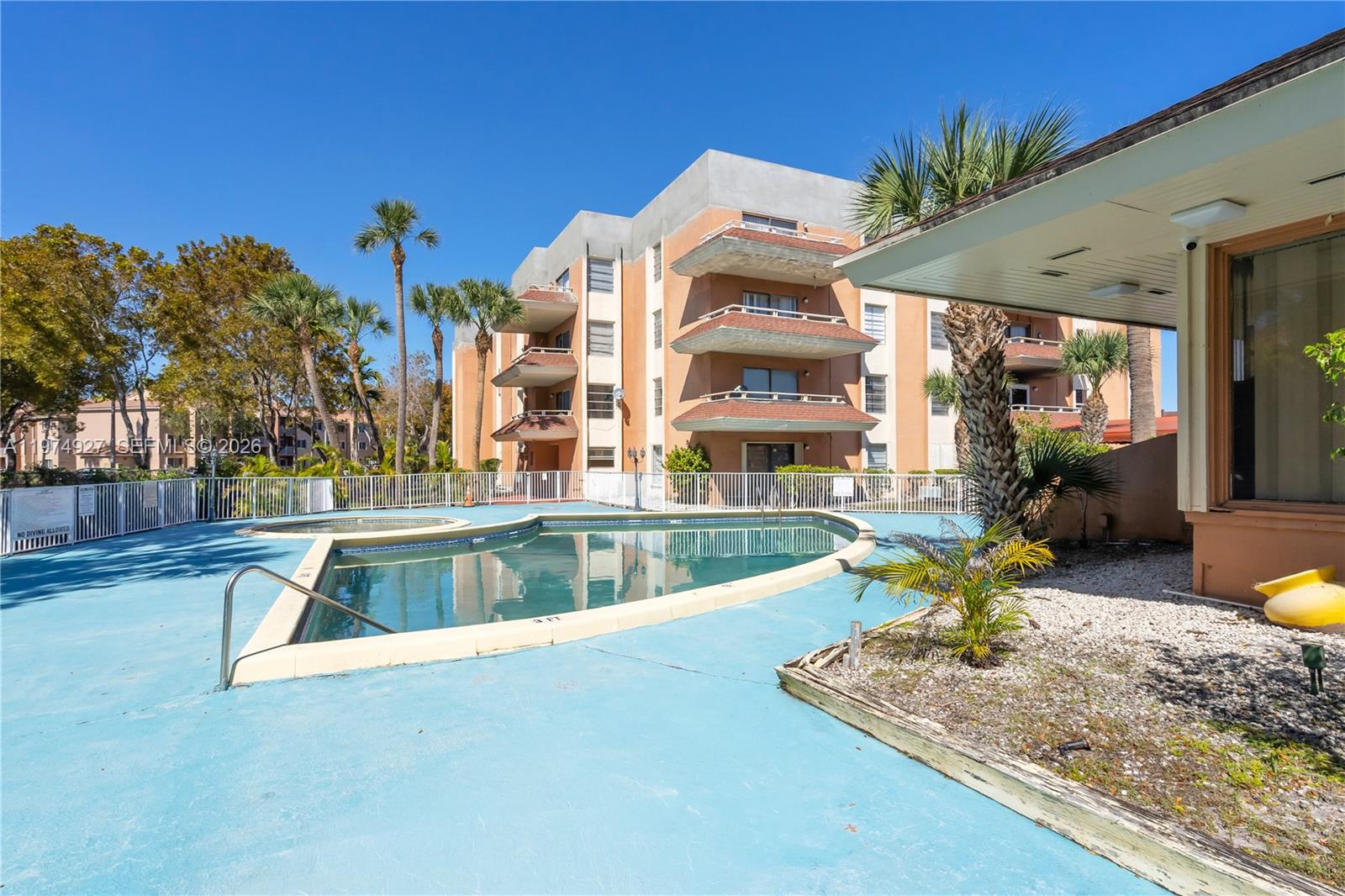 17530 Northwest 68th Avenue, Unit C2003 Hialeah, FL 33015 - Photo 7 of 20 a view of a house with swimming pool and sitting area