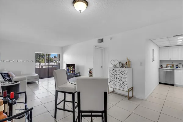 a view of a livingroom with furniture and lounge chair