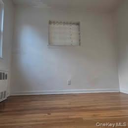 38-21 149th Place Queens, NY 11354 - Photo 11 of 11 a room with a bench