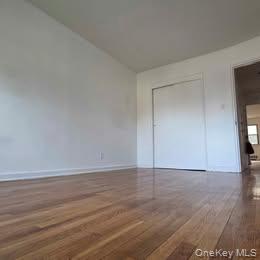 38-21 149th Place Queens, NY 11354 - Photo 9 of 11 a view of an empty room and window