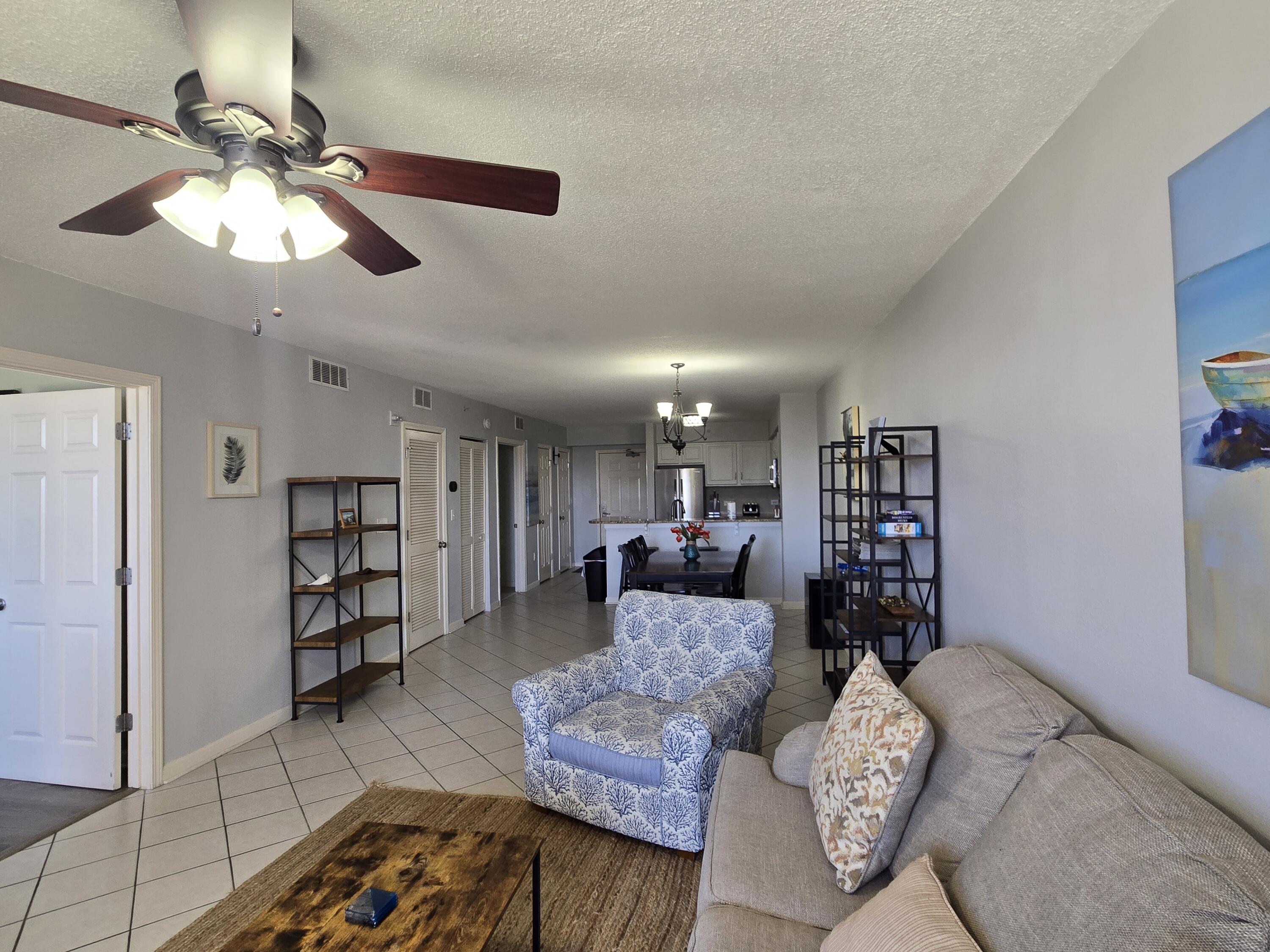 970 Highway 98, Unit 206 Destin, FL 32541 - Photo 9 of 10 a living room with furniture and wooden floor