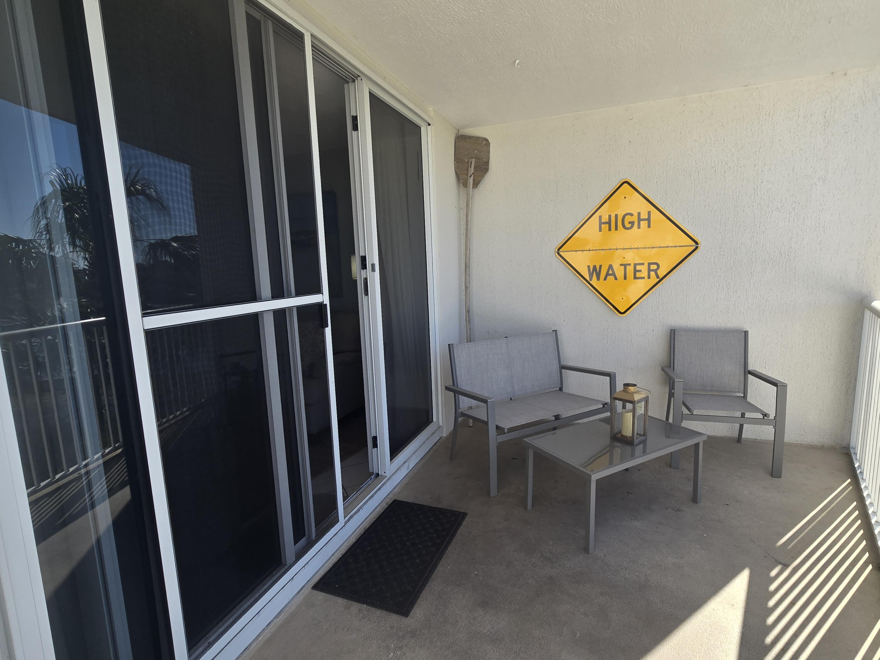 970 Highway 98, Unit 206 Destin, FL 32541 - Photo 10 of 10 a view of a hallway with furniture and a entryway