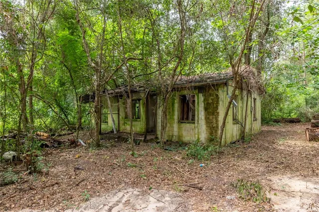 a backyard of a house with lots of green space
