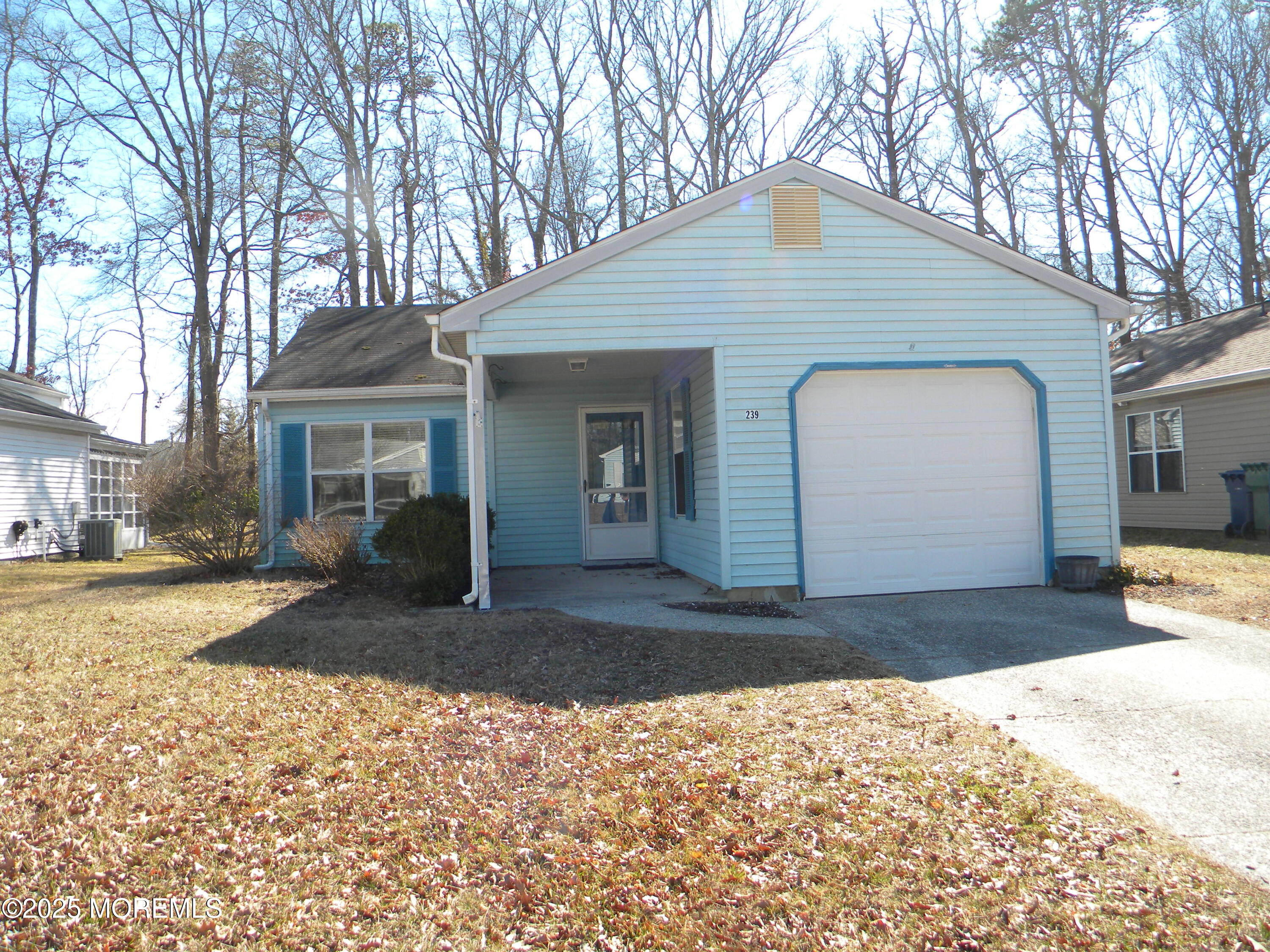 239 Valley Forge Drive Little Egg Harbor, NJ 08087 - Photo 1 of 24 a front view of a house with a yard and garage