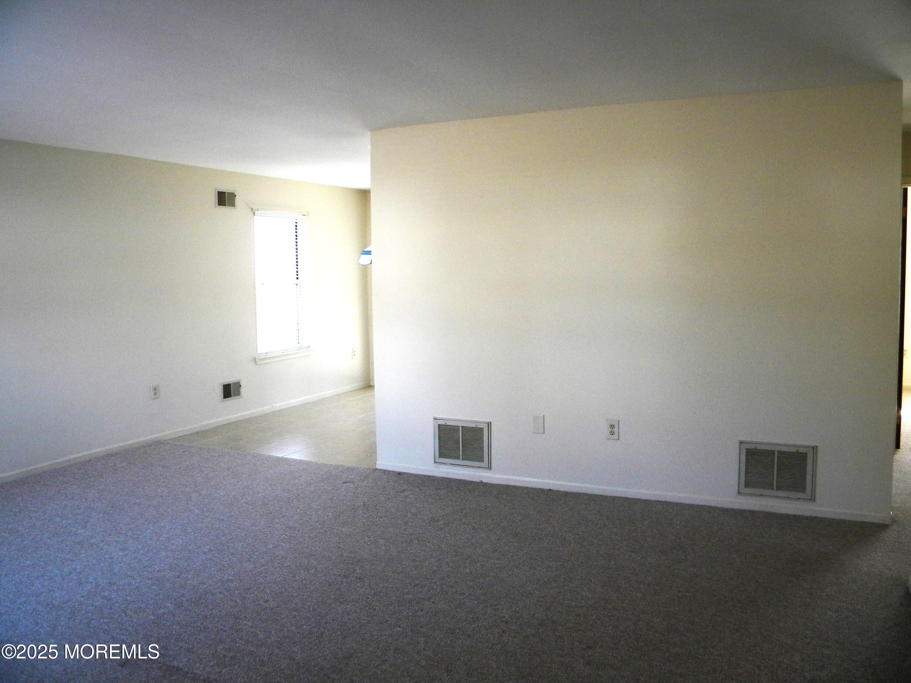 239 Valley Forge Drive Little Egg Harbor, NJ 08087 - Photo 6 of 24 an empty room with a empty space and windows