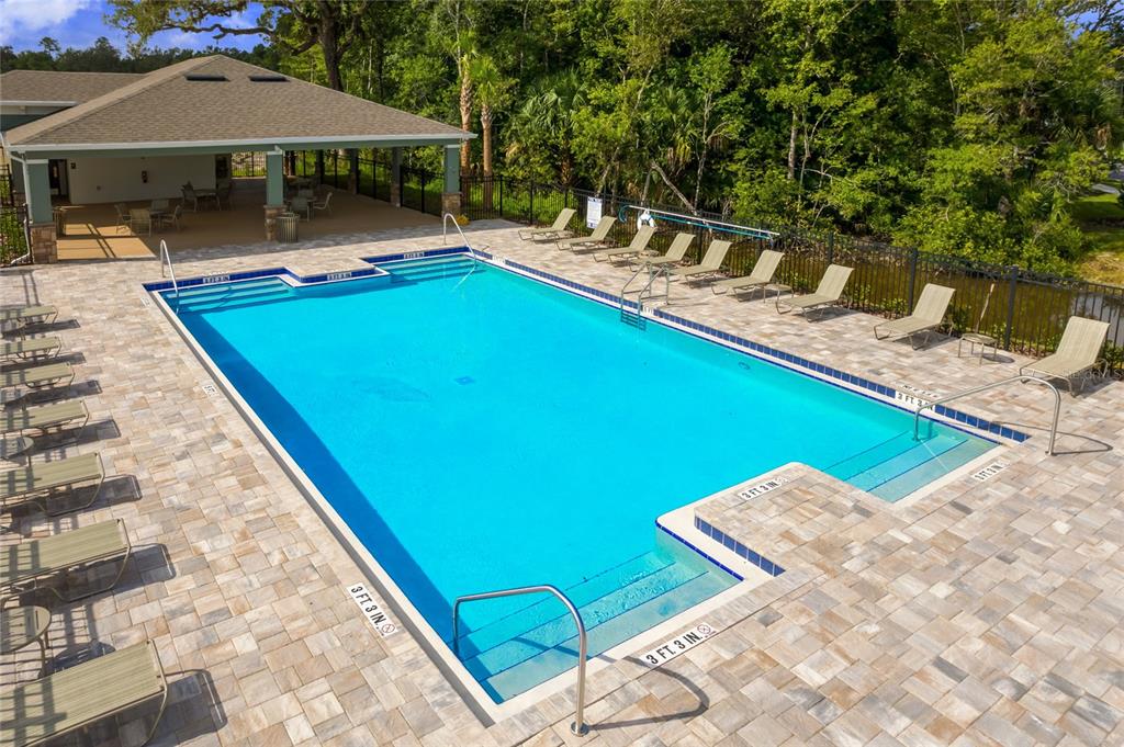2131 Red Rock Road New Smyrna Beach, FL 32168 - Photo 19 of 20 a view of swimming pool with chairs in patio