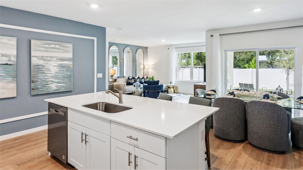 2131 Red Rock Road New Smyrna Beach, FL 32168 - Photo 5 of 20 a large white kitchen with a large window