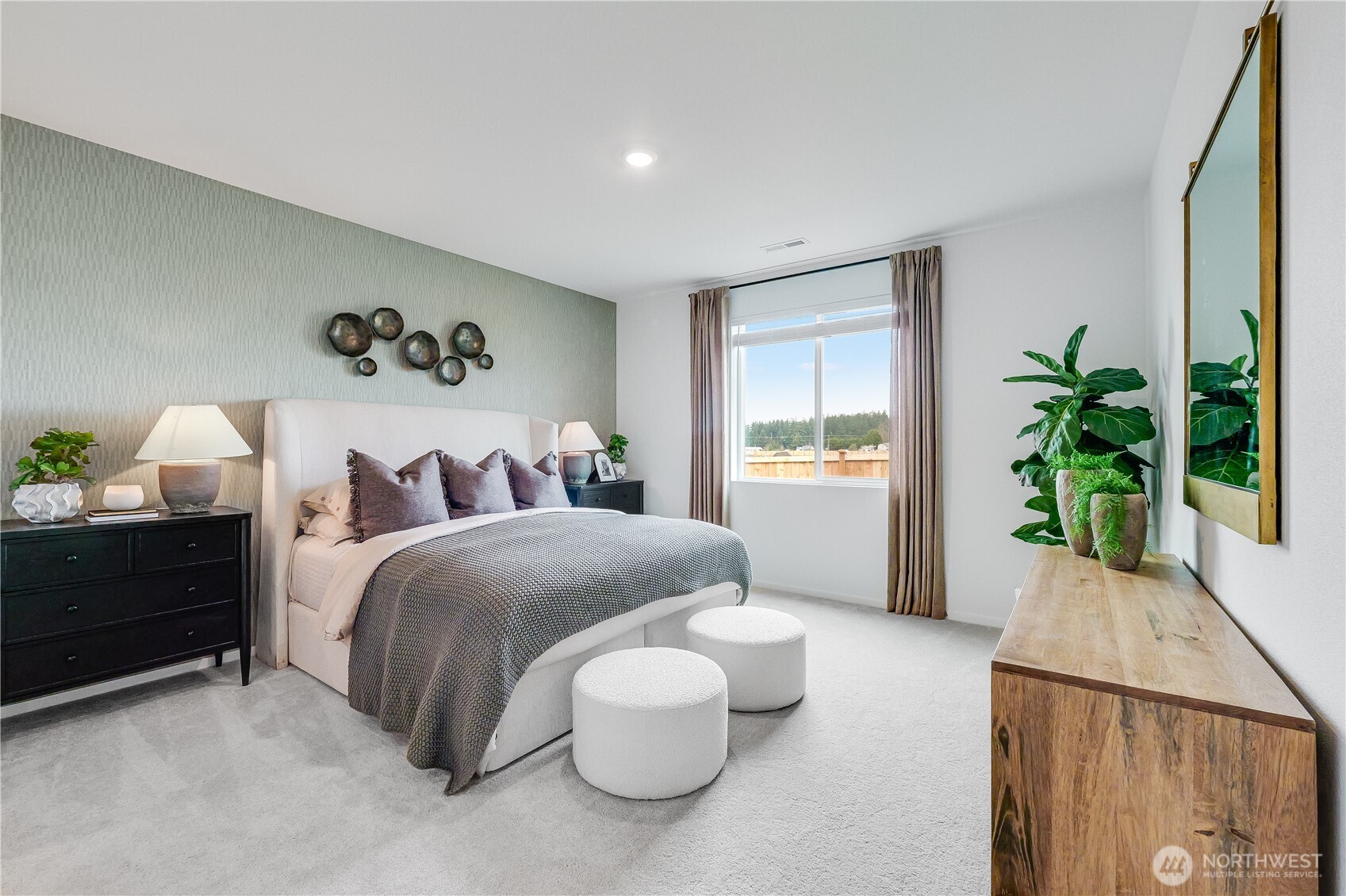 132 Moonshadow Lane Sequim, WA 98382 - Photo 13 of 28 a bedroom with a bed and a potted plant