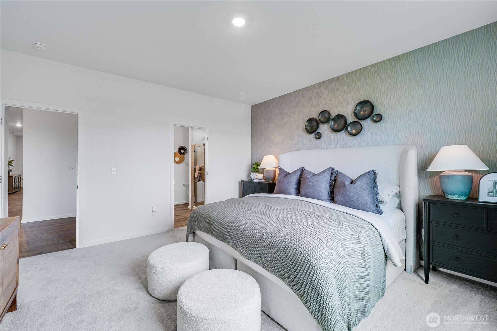132 Moonshadow Lane Sequim, WA 98382 - Photo 14 of 28 a bedroom with a bed and a painting on the wall