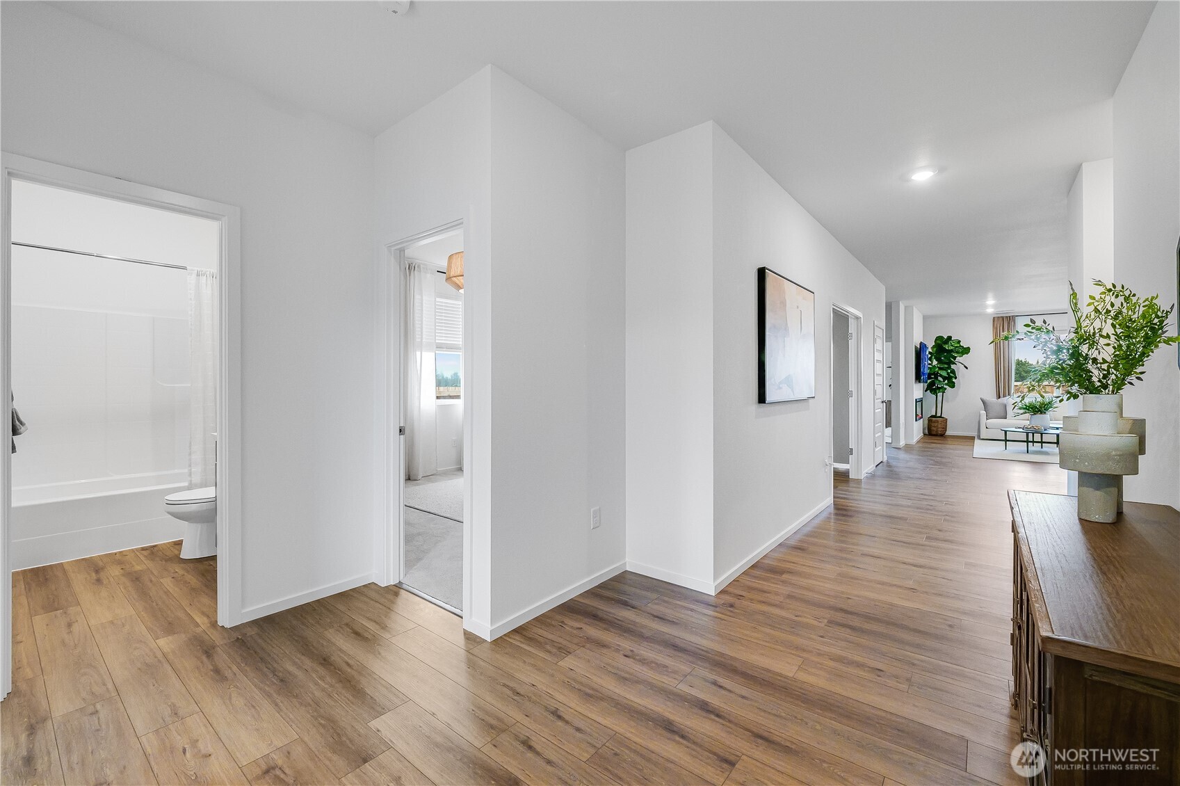 132 Moonshadow Lane Sequim, WA 98382 - Photo 18 of 28 an empty room with wooden floor and windows