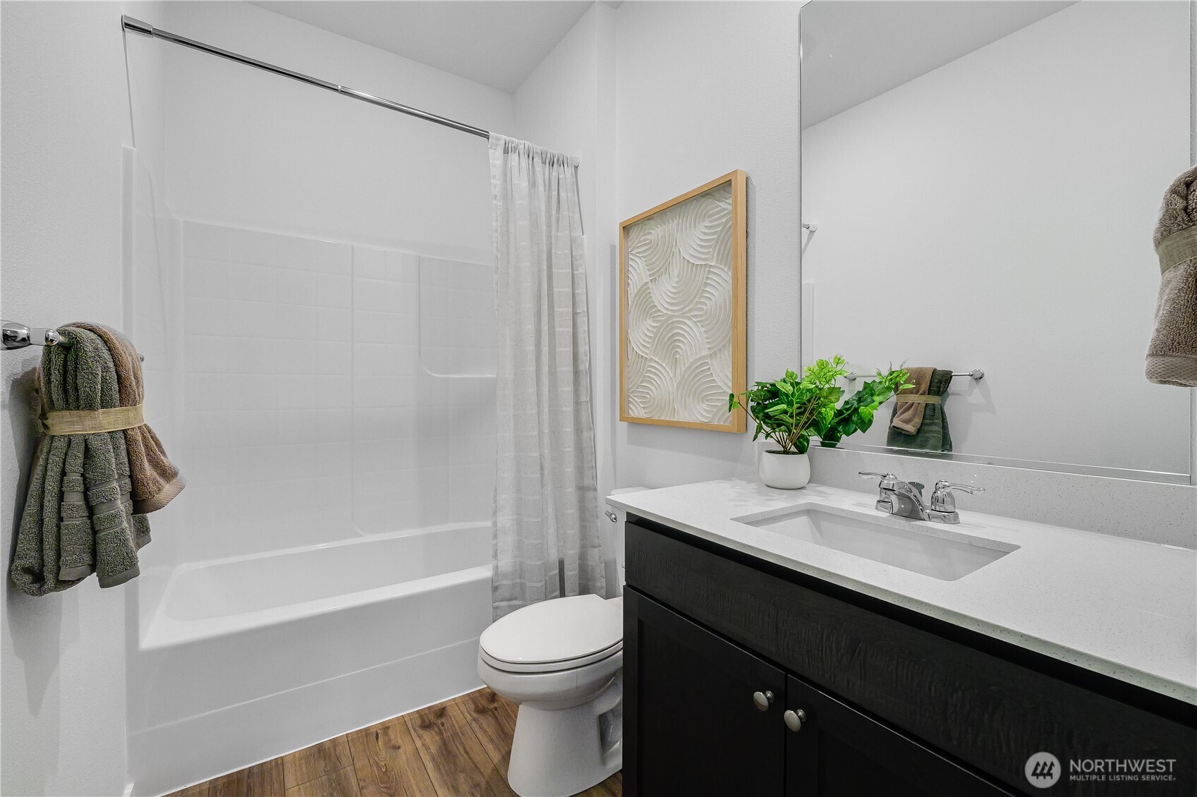 132 Moonshadow Lane Sequim, WA 98382 - Photo 22 of 28 a bathroom with a sink a toilet and shower