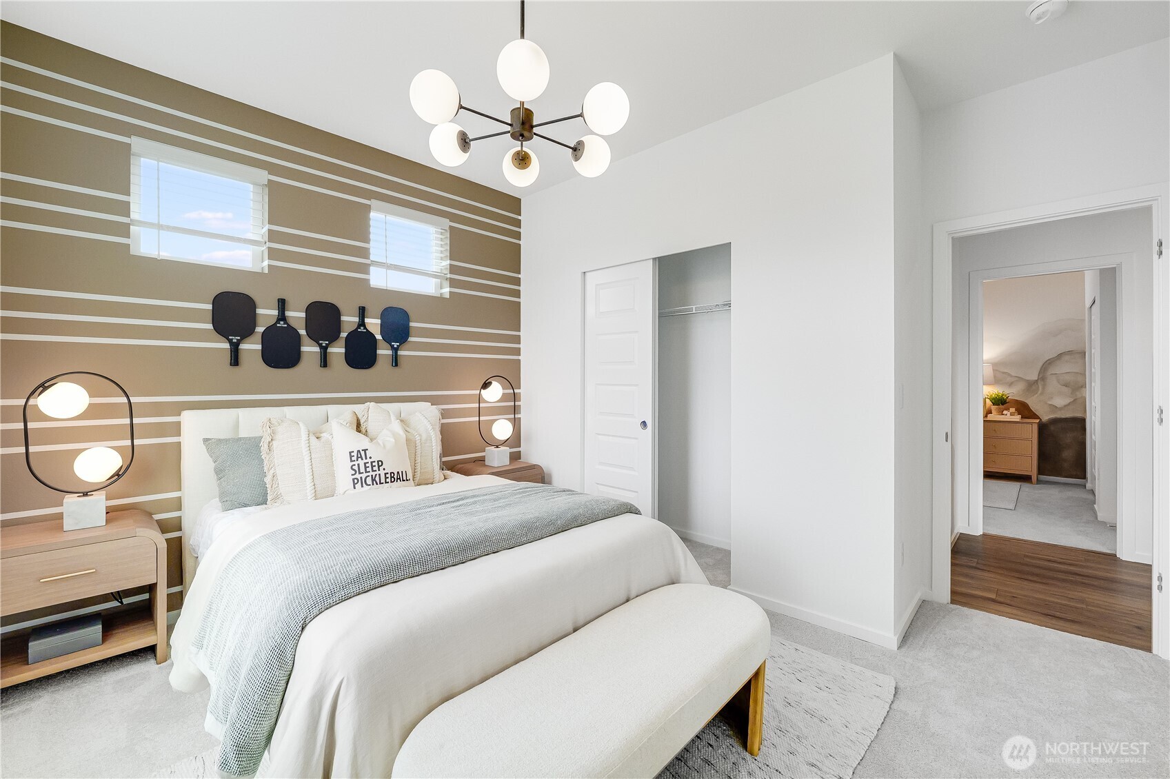 132 Moonshadow Lane Sequim, WA 98382 - Photo 24 of 28 a bedroom with a bed and a chandelier