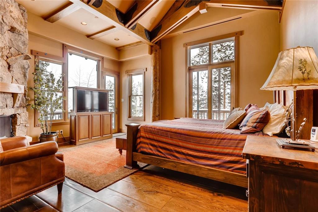 382 Timbertrail Road Breckenridge, CO 80424 - Photo 14 of 25 a bedroom with furniture and large windows