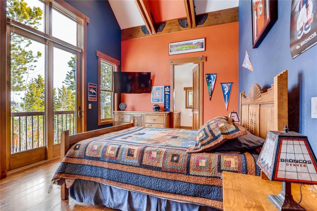 382 Timbertrail Road Breckenridge, CO 80424 - Photo 22 of 25 a bedroom with a bed next to a window