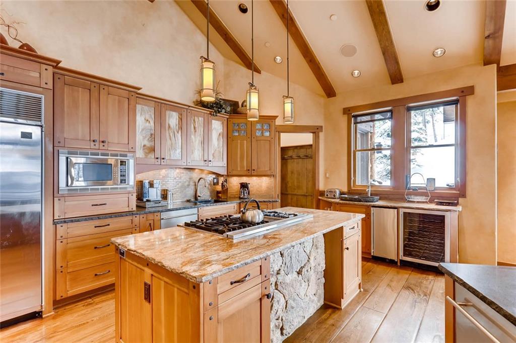 382 Timbertrail Road Breckenridge, CO 80424 - Photo 8 of 25 a kitchen with stainless steel appliances granite countertop a stove a sink dishwasher and a refrigerator