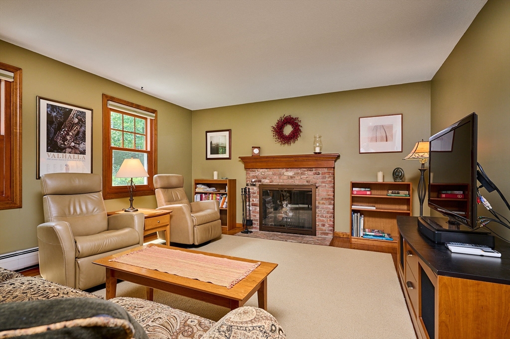 72 Reservation Road Sunderland, MA 01375 - Photo 11 of 38 a living room with furniture and a flat screen tv