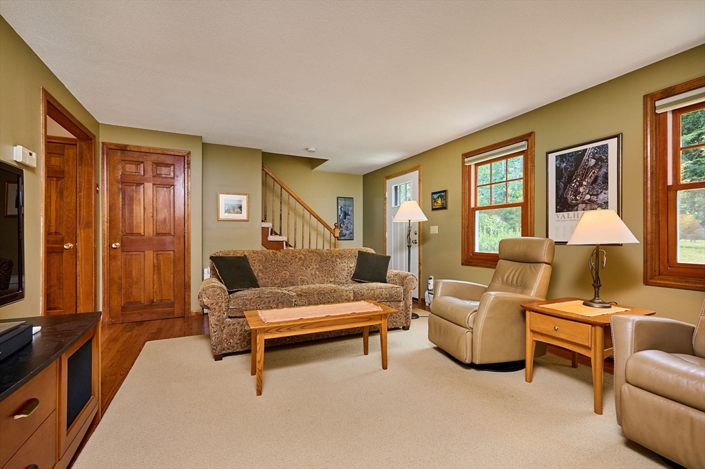 72 Reservation Road Sunderland, MA 01375 - Photo 12 of 38 a living room with furniture and a flat screen tv