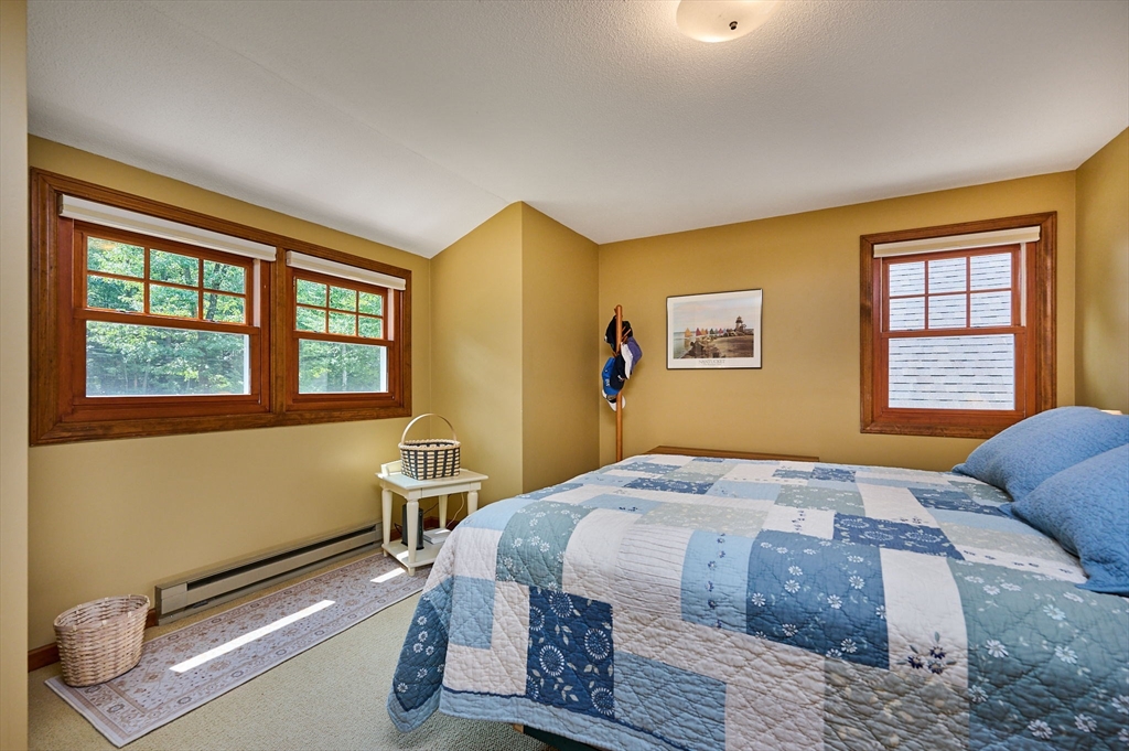 72 Reservation Road Sunderland, MA 01375 - Photo 16 of 38 a bedroom with a bed and wooden floor