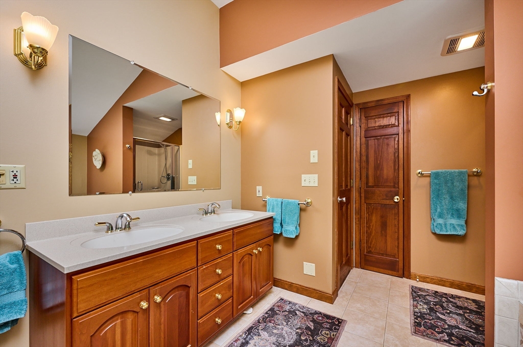 72 Reservation Road Sunderland, MA 01375 - Photo 20 of 38 a spacious bathroom with a granite countertop sink and a mirror
