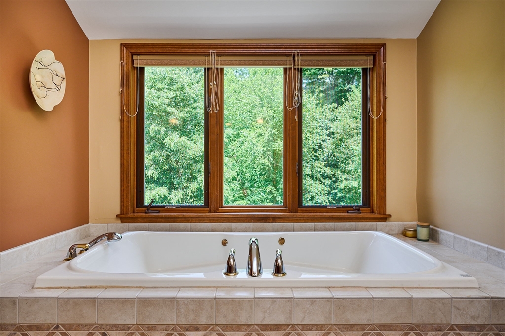 72 Reservation Road Sunderland, MA 01375 - Photo 21 of 38 a bathroom with a bathtub and window