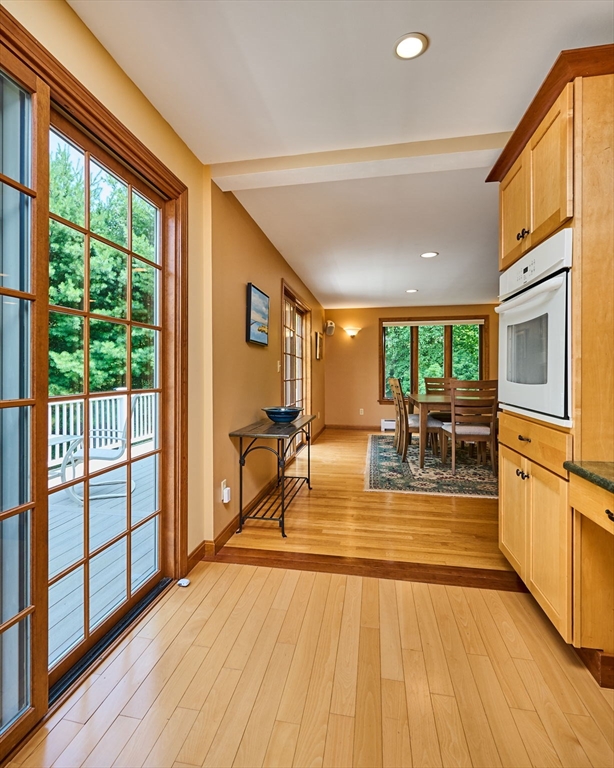 72 Reservation Road Sunderland, MA 01375 - Photo 7 of 38 a view of a living room and kitchen with a flat screen tv