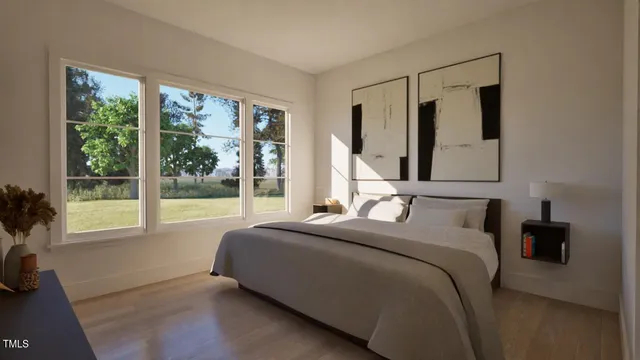 a bedroom with a large bed and a large window