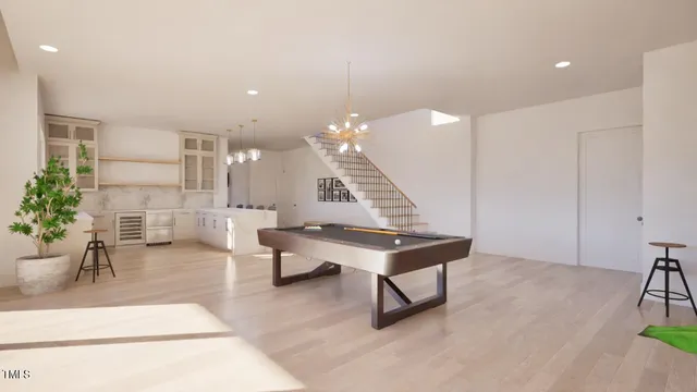 a room with lots of furniture and a chandelier