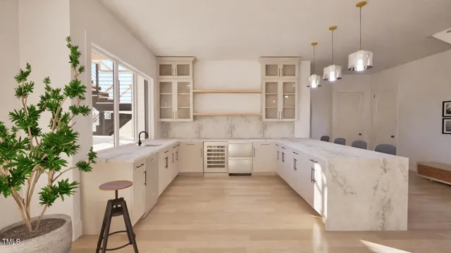 a large white kitchen with a large window